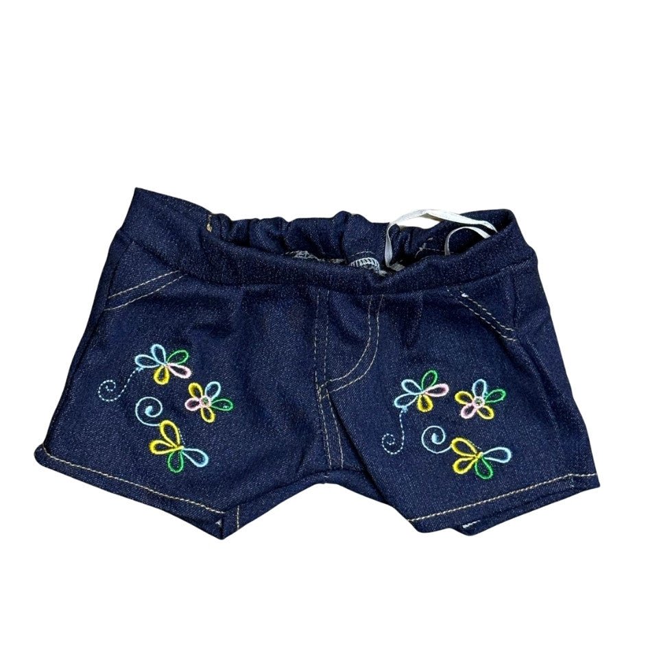 Flower jeans set - voor knuffel - Make a bearEen jeans broekje met bloemetje borduring. Is het broekje van het setje Flower jeans voor knuffels. te koop bij Make a Bear.